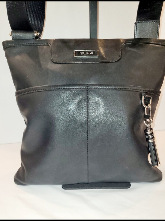 Tumi Handbags - Tumi Black Leather Crossbody with Tassel Charm